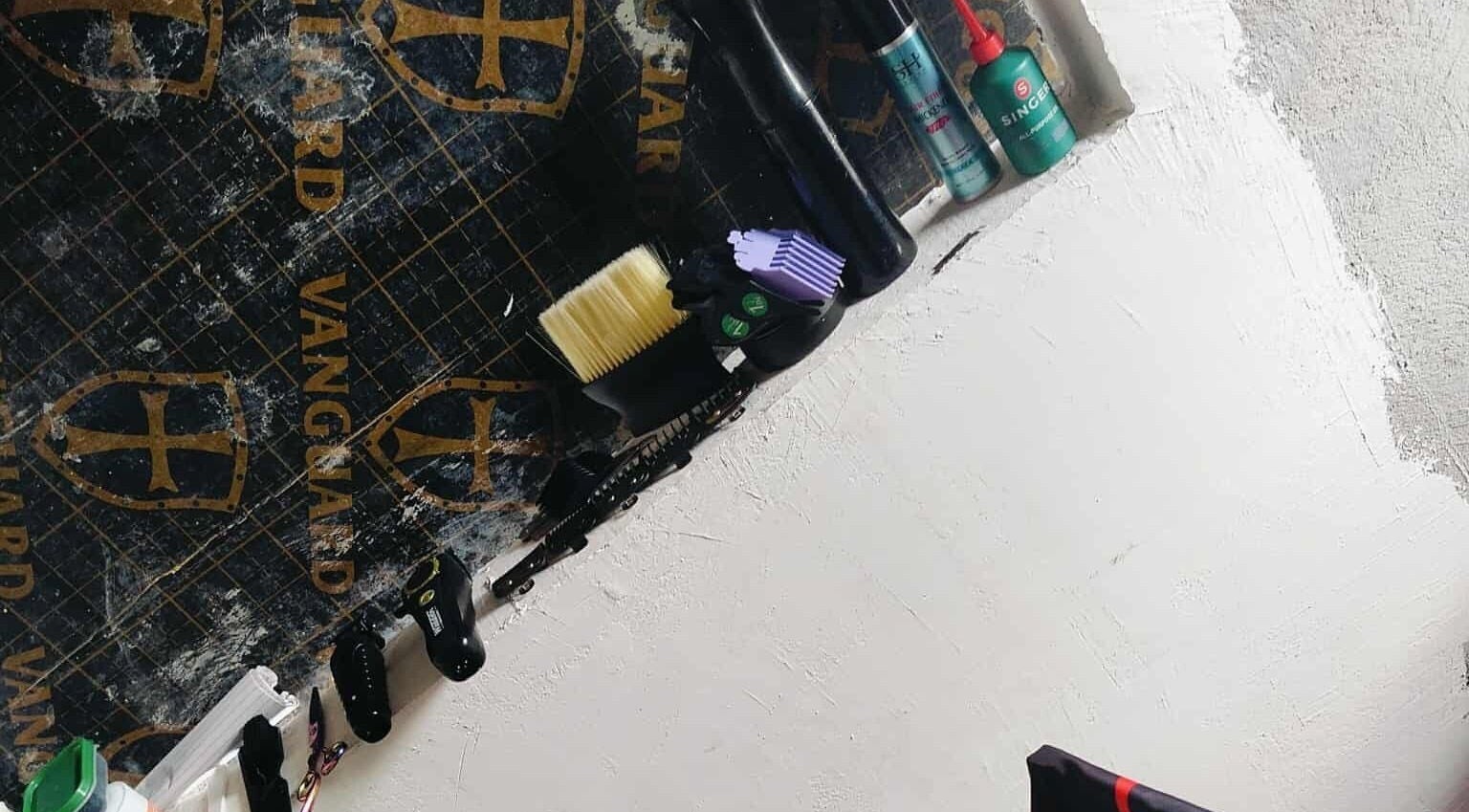 Barber tools displayed on a shelf at BARBERJAY, Cainta, Calabarzon, PH.