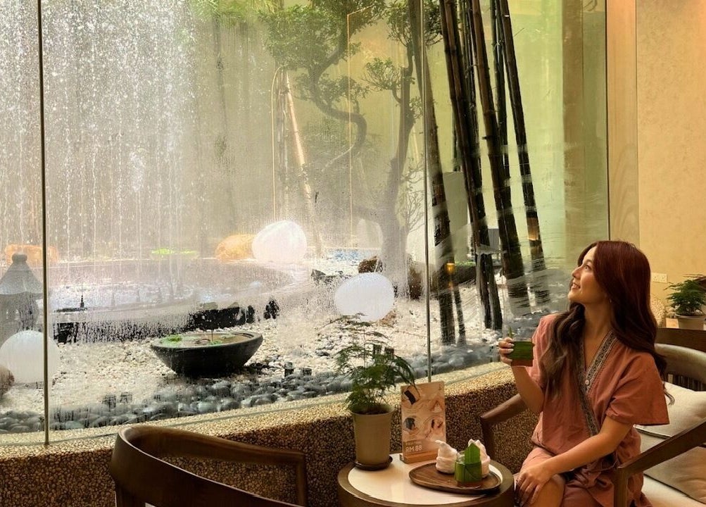 Relaxing view at Billion Onsen Aesthetic & Headspa, Kuala Lumpur, featuring lush garden and tranquil ambiance.