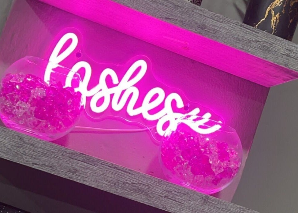 Vibrant pink neon sign at The BeautyLoft by Dannique, Ocho Rios, St. Ann Parish, JM, enhances modern decor.