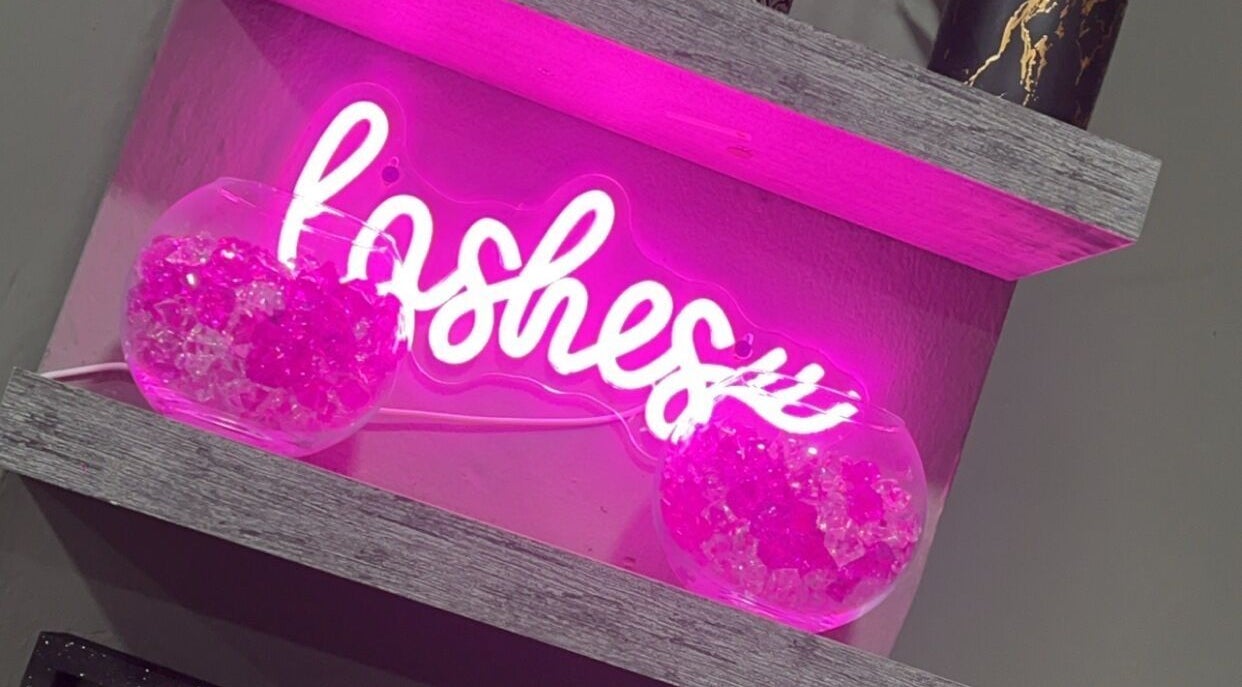 Vibrant pink neon sign at The BeautyLoft by Dannique, Ocho Rios, St. Ann Parish, JM, enhances modern decor.
