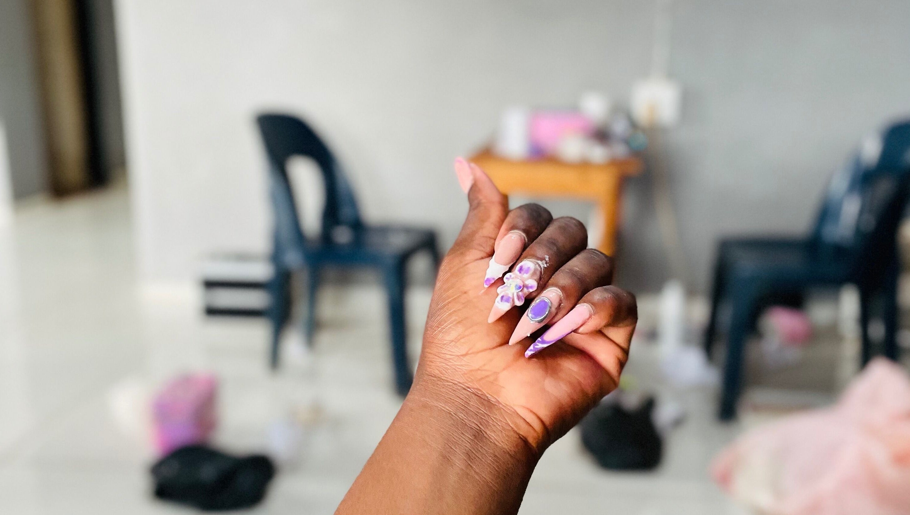 Intricate nail art at Mini Nails Bar, Pongola, KZN, ZA. Showcases stunning, detailed manicure designs.