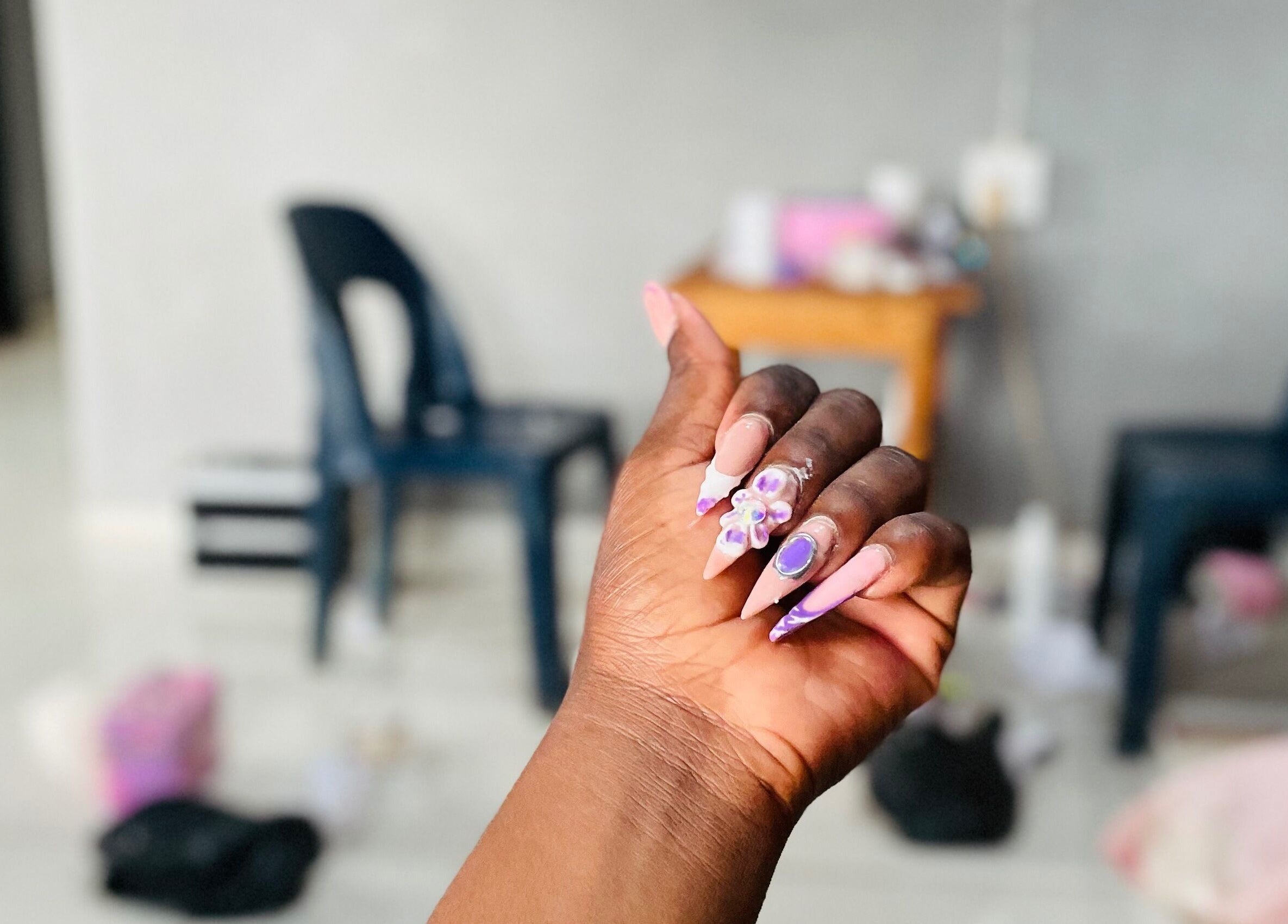 Intricate nail art at Mini Nails Bar, Pongola, KZN, ZA. Showcases stunning, detailed manicure designs.