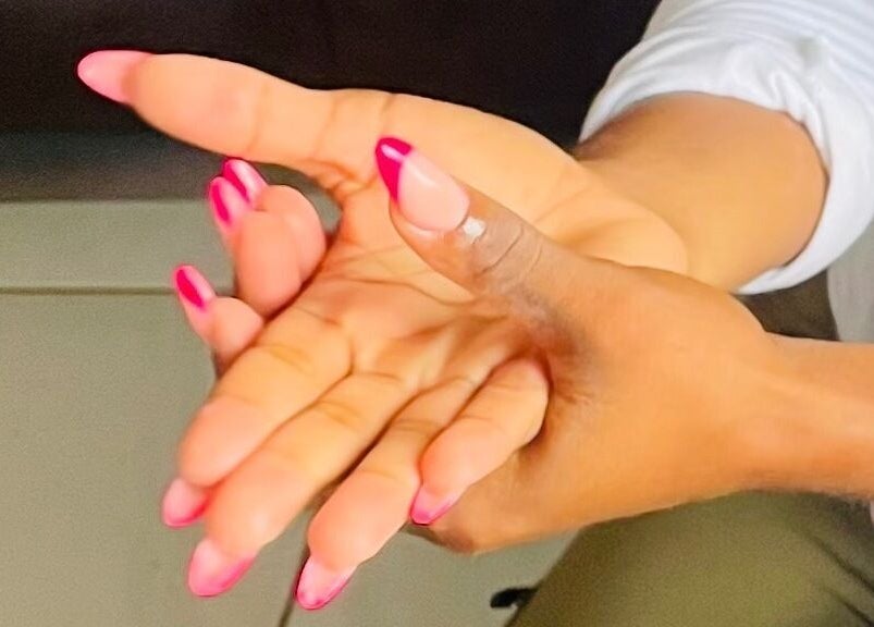 Stylish pink-tipped manicured nails at Mini Nails Bar in Pongola, KZN, ZA, showcasing expert nail craftsmanship.