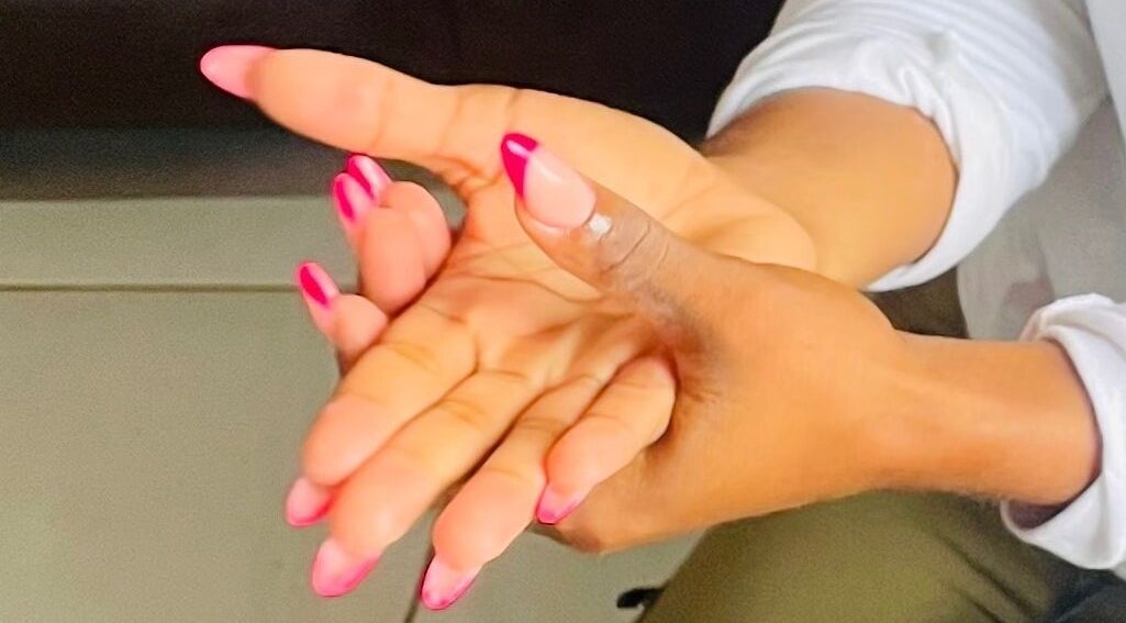 Stylish pink-tipped manicured nails at Mini Nails Bar in Pongola, KZN, ZA, showcasing expert nail craftsmanship.