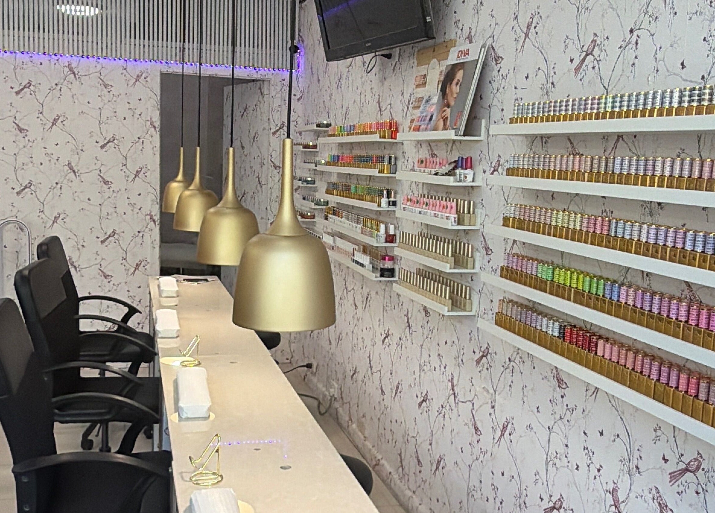 Elegant manicure space at Harmonia Beauty, Prahran, Victoria, AU with chic decor and nail polish displays.