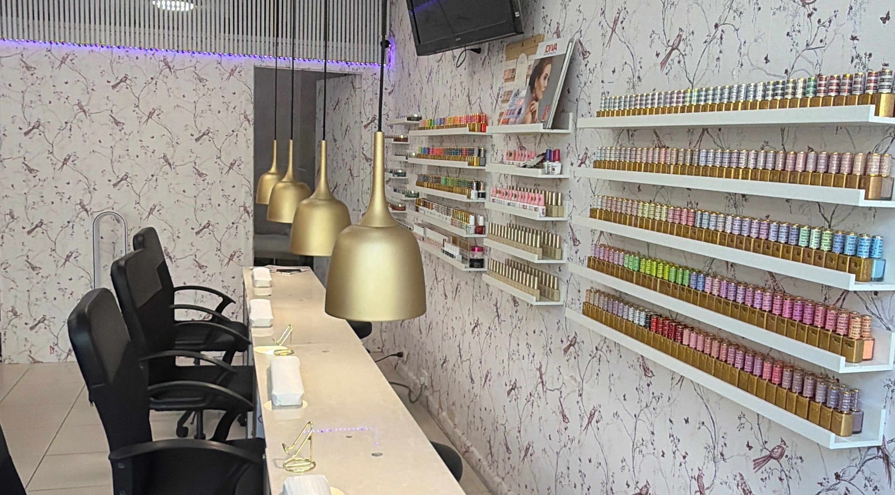 Elegant manicure space at Harmonia Beauty, Prahran, Victoria, AU with chic decor and nail polish displays.