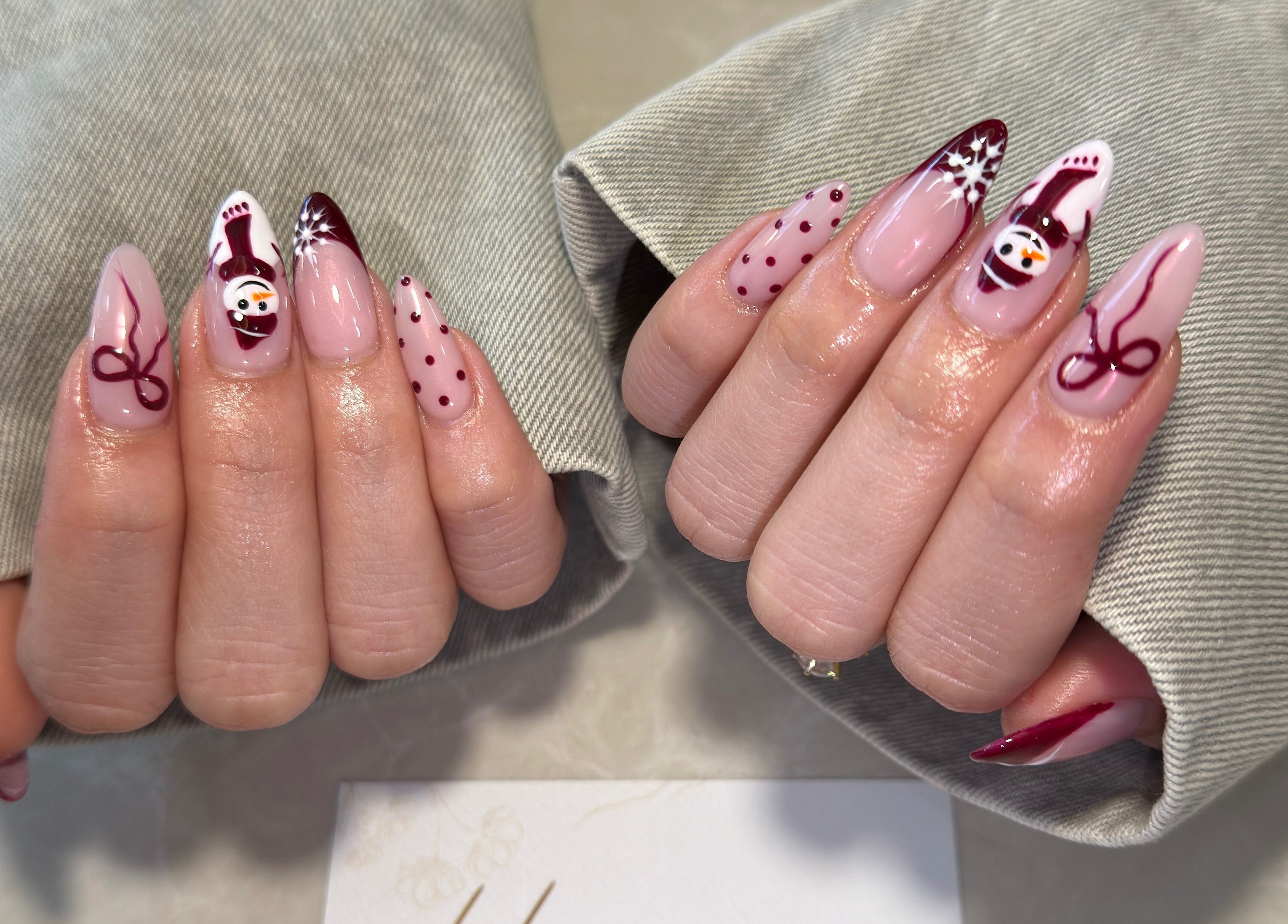 Holiday-themed nail art at Harmonia Beauty in Prahran, Victoria, AU. Features snowmen and winter motifs.