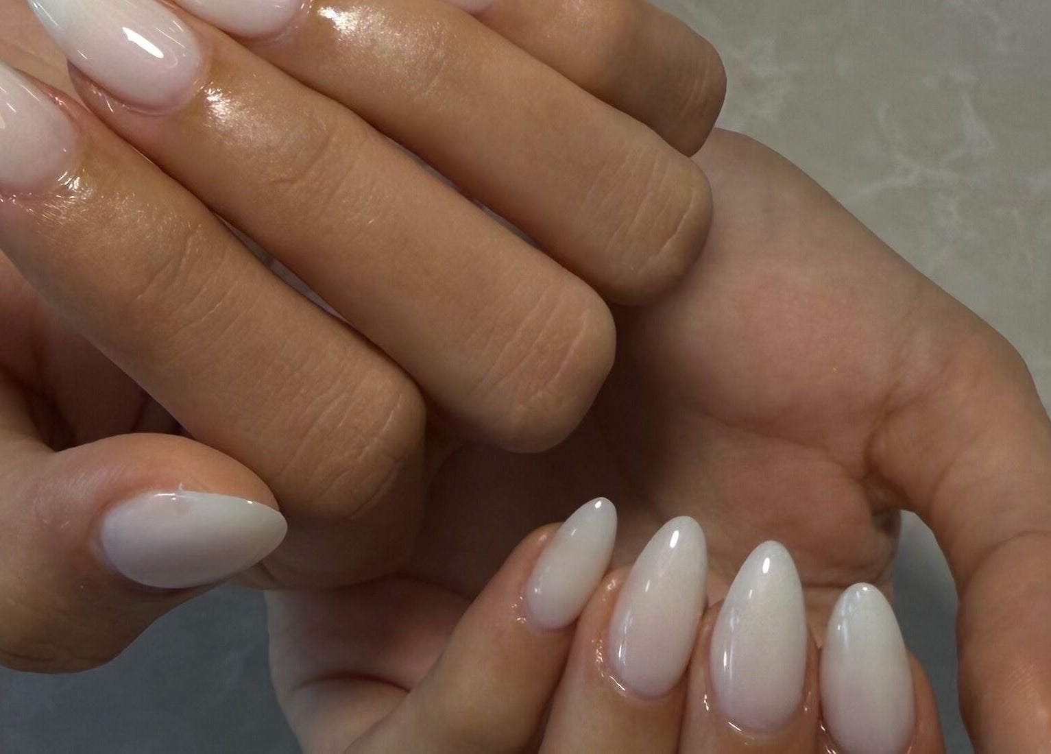 Elegant white manicure at Harmonia Beauty in Prahran, Victoria, AU. Perfectly shaped nails.