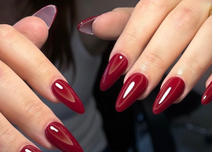 Elegant red stiletto nails at Harmonia Beauty, Prahran, Victoria, AU, showcasing modern nail artistry.