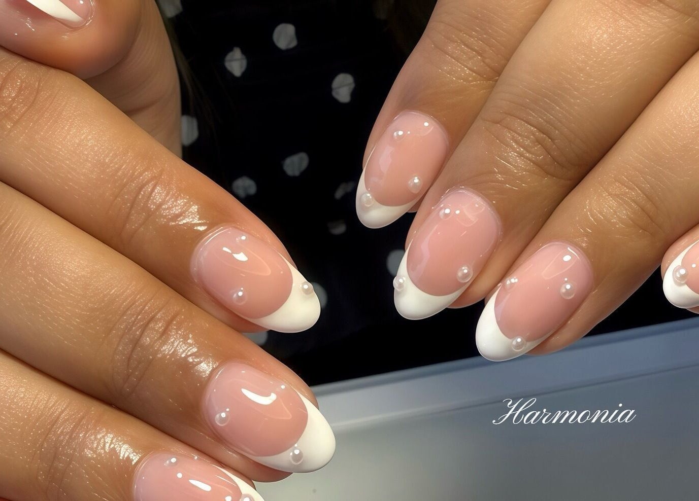 Elegant French tip nails with pearls at Harmonia Beauty, Prahran, Victoria, AU.
