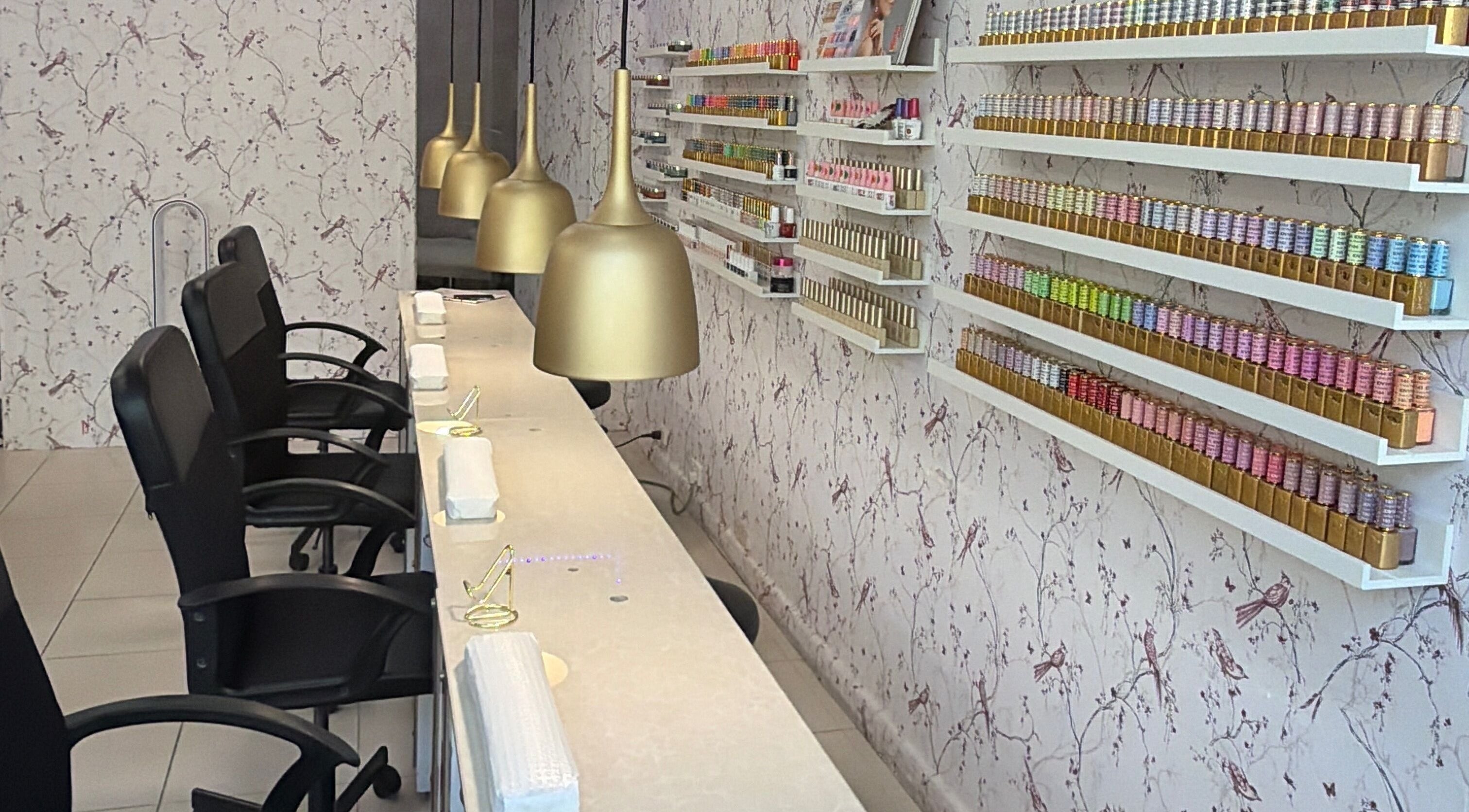 Elegant nail salon at Harmonia Beauty, Prahran, Victoria, AU, with chic design and organized polish display.
