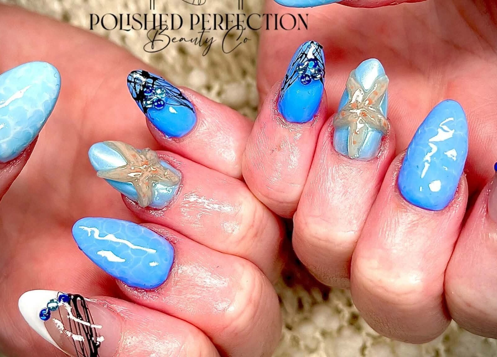 Nail art with blue and starfish theme at Polished Perfection Beauty Co., Werrington Downs, New South Wales, AU.