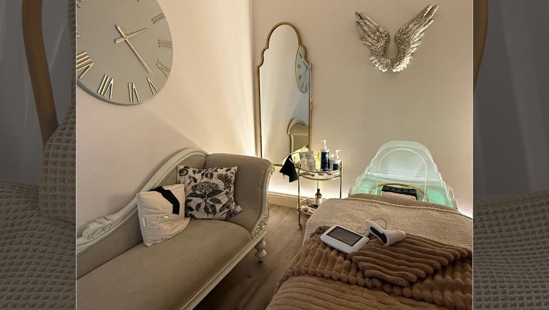 Luxurious spa room at Body Tingle, Forncett End, England, GB, featuring plush seating and serene ambiance.