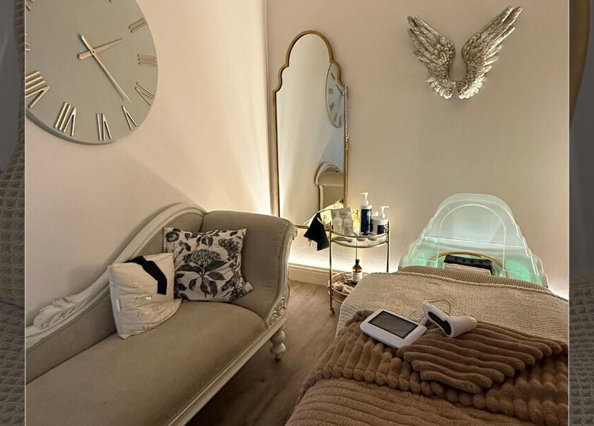 Luxurious spa room at Body Tingle, Forncett End, England, GB, featuring plush seating and serene ambiance.