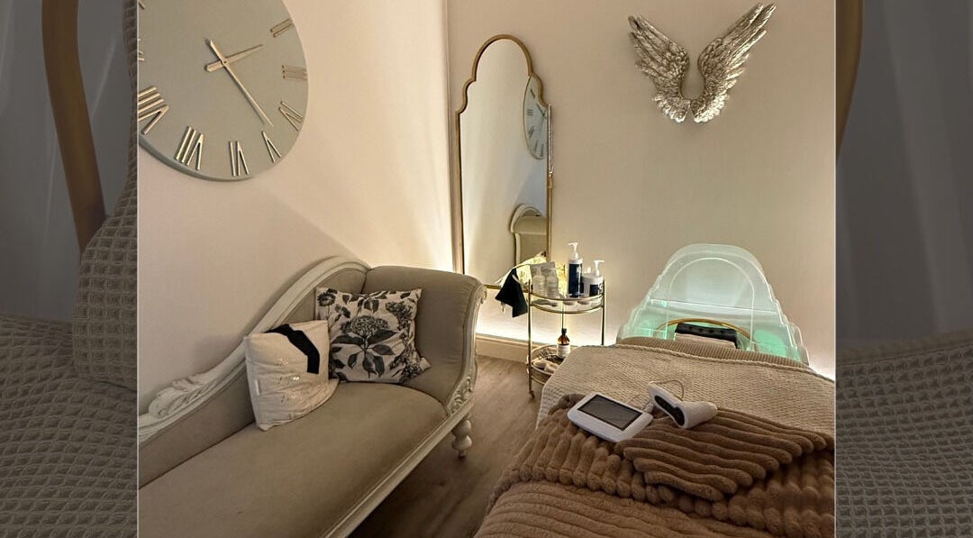 Luxurious spa room at Body Tingle, Forncett End, England, GB, featuring plush seating and serene ambiance.