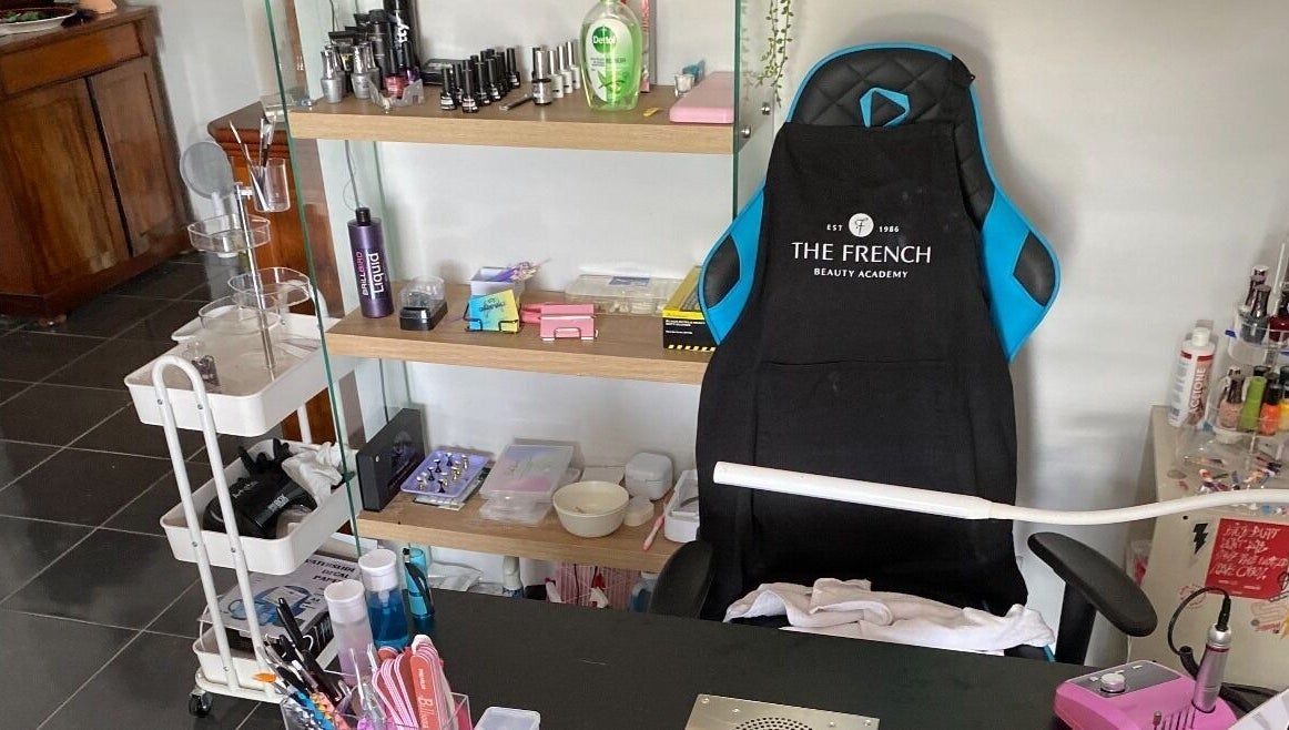 Gnarly Nailz salon workspace in Camira, Queensland, AU, featuring manicure tools and products.