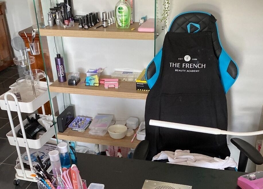 Gnarly Nailz salon workspace in Camira, Queensland, AU, featuring manicure tools and products.