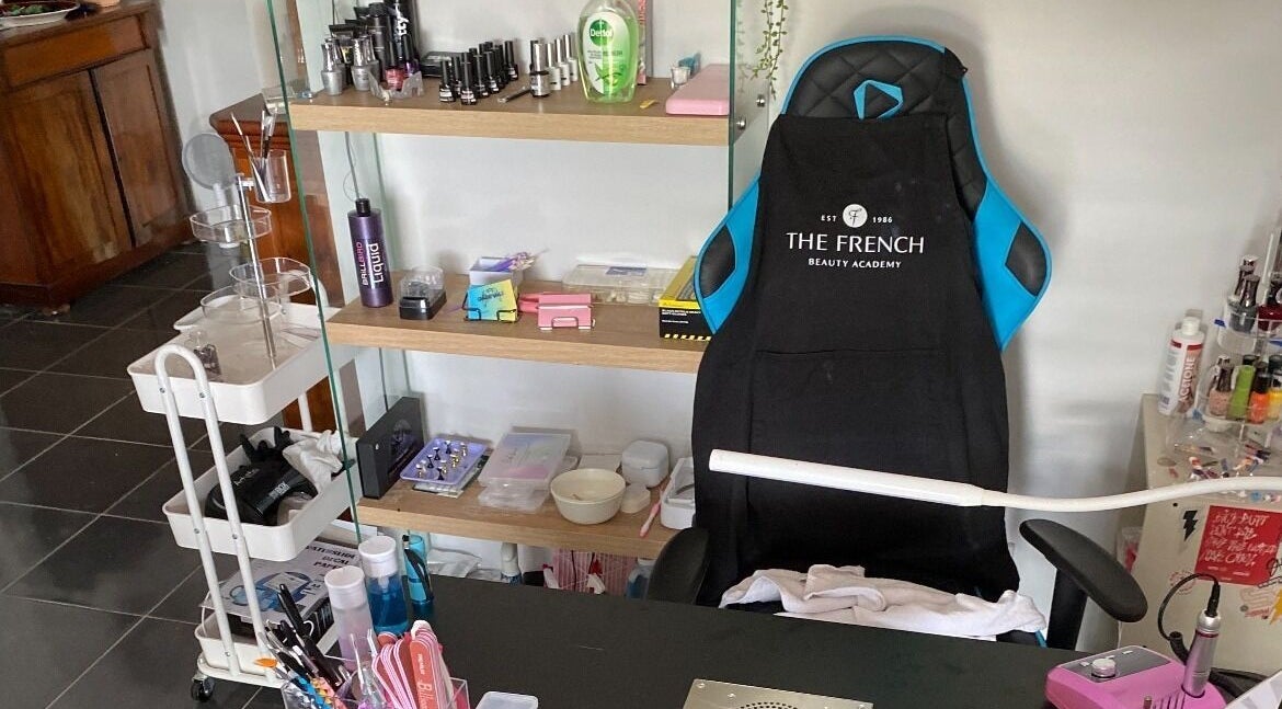 Gnarly Nailz salon workspace in Camira, Queensland, AU, featuring manicure tools and products.