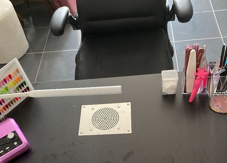 Manicure station at Gnarly Nailz in Camira, Queensland, AU featuring tools and color samples.