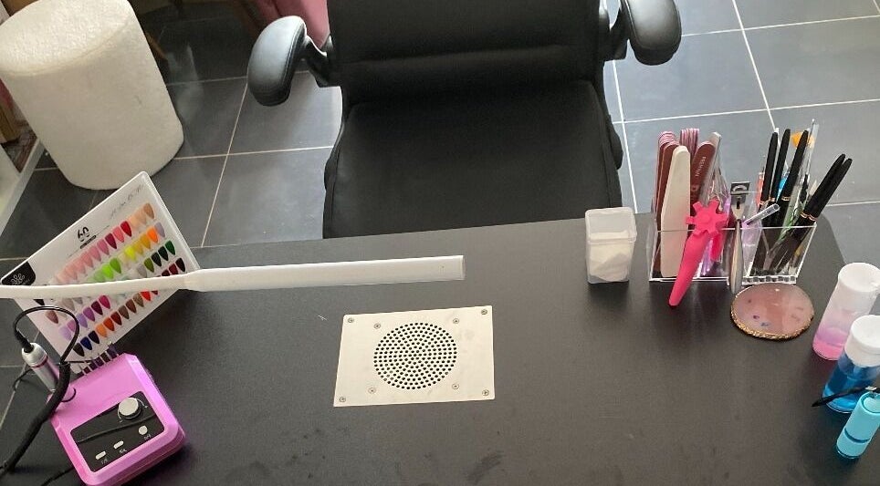 Manicure station at Gnarly Nailz in Camira, Queensland, AU featuring tools and color samples.