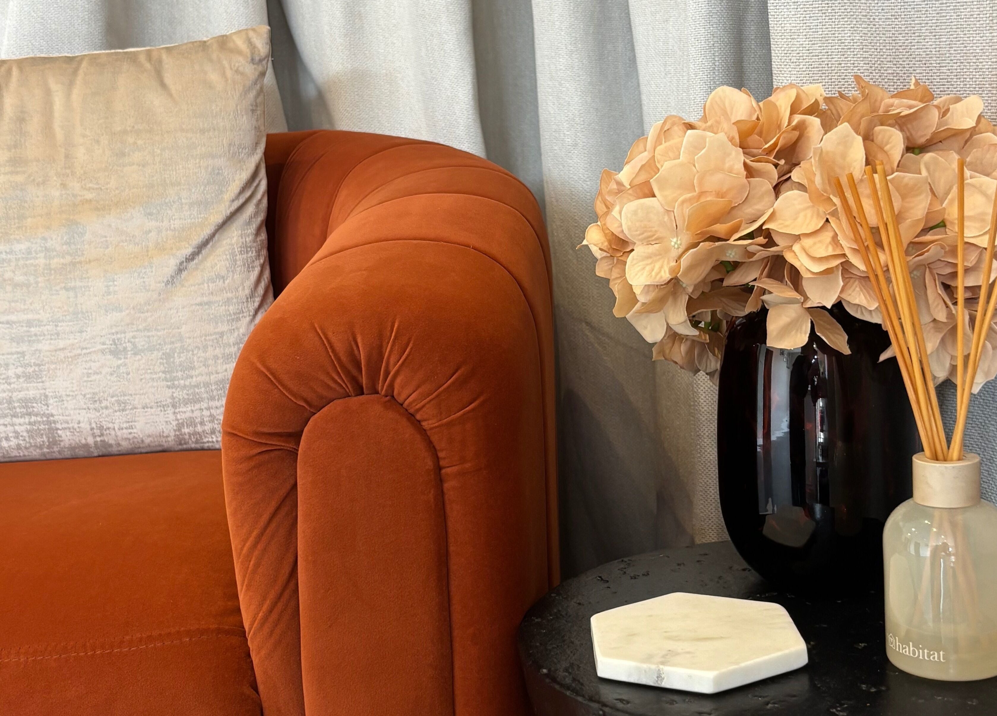 Luxurious velvet sofa with floral decor at Fine Little Things Studios, Bury St Edmund’s, England, GB.