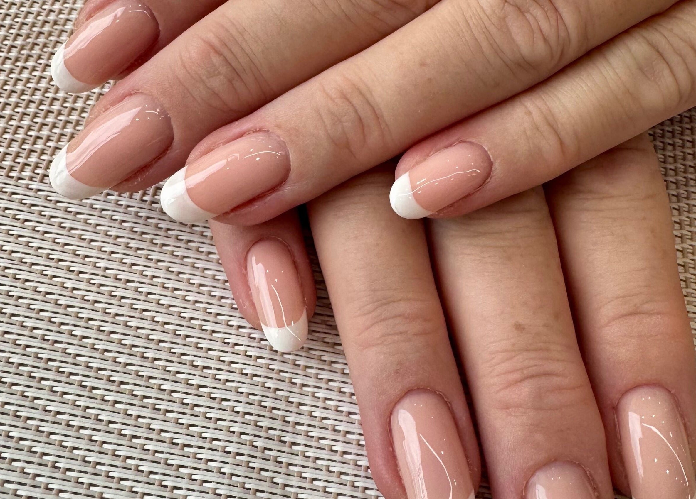 French manicure nails at Zara Nails in Kingston Upon Thames, England, GB, showcasing elegant nail design.