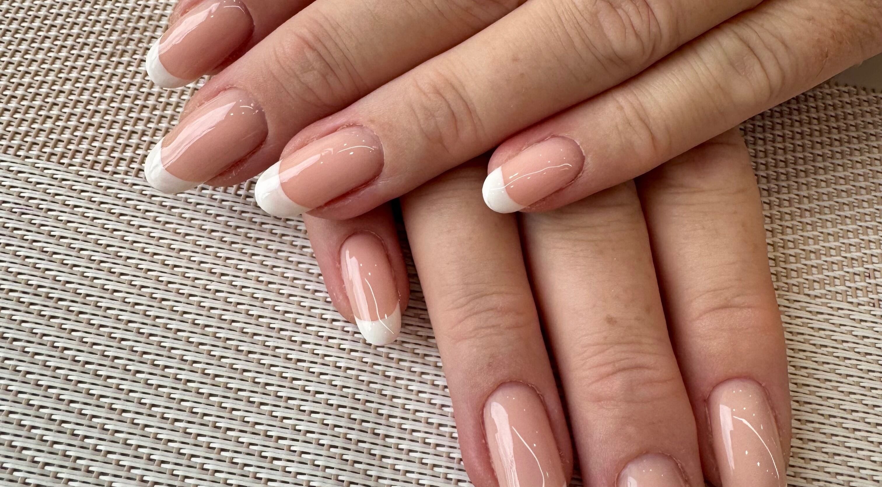 French manicure nails at Zara Nails in Kingston Upon Thames, England, GB, showcasing elegant nail design.