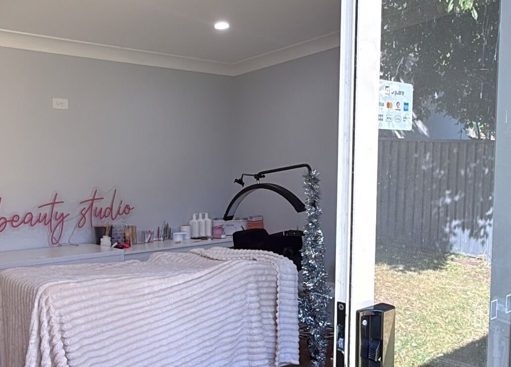 Cozy treatment room at The Beauty Studio, Wilberforce, NSW, AU showcasing a bed and beauty tools.