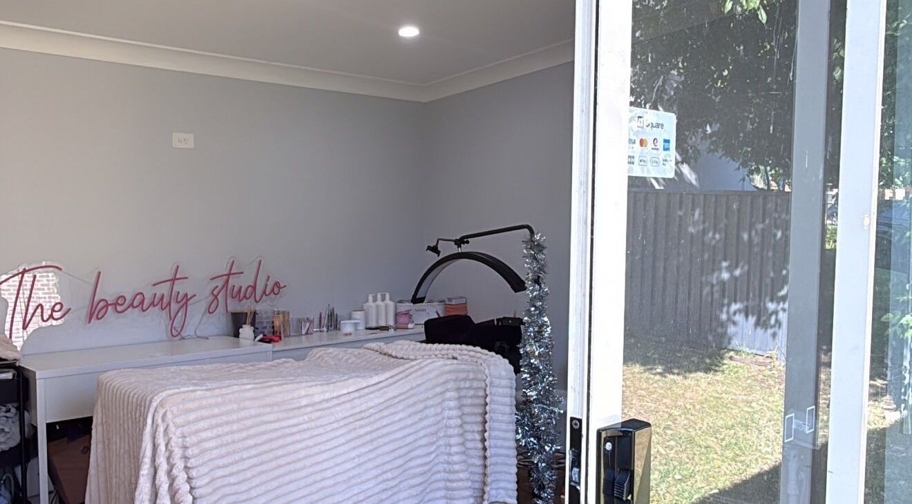 Cozy treatment room at The Beauty Studio, Wilberforce, NSW, AU showcasing a bed and beauty tools.