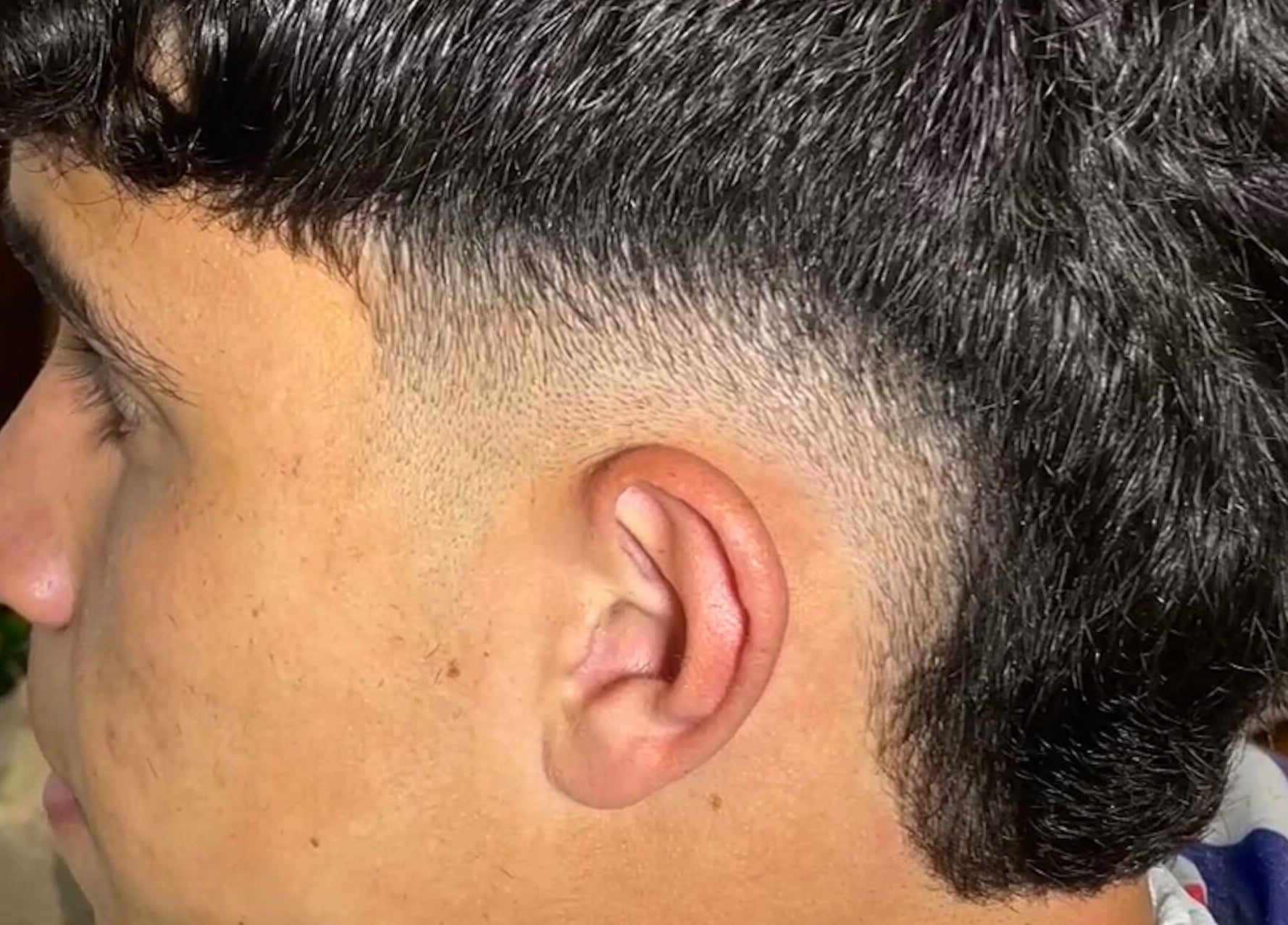 Close-up of a sleek fade haircut at IcebarberStudio, San Luis, San Luis, AR.