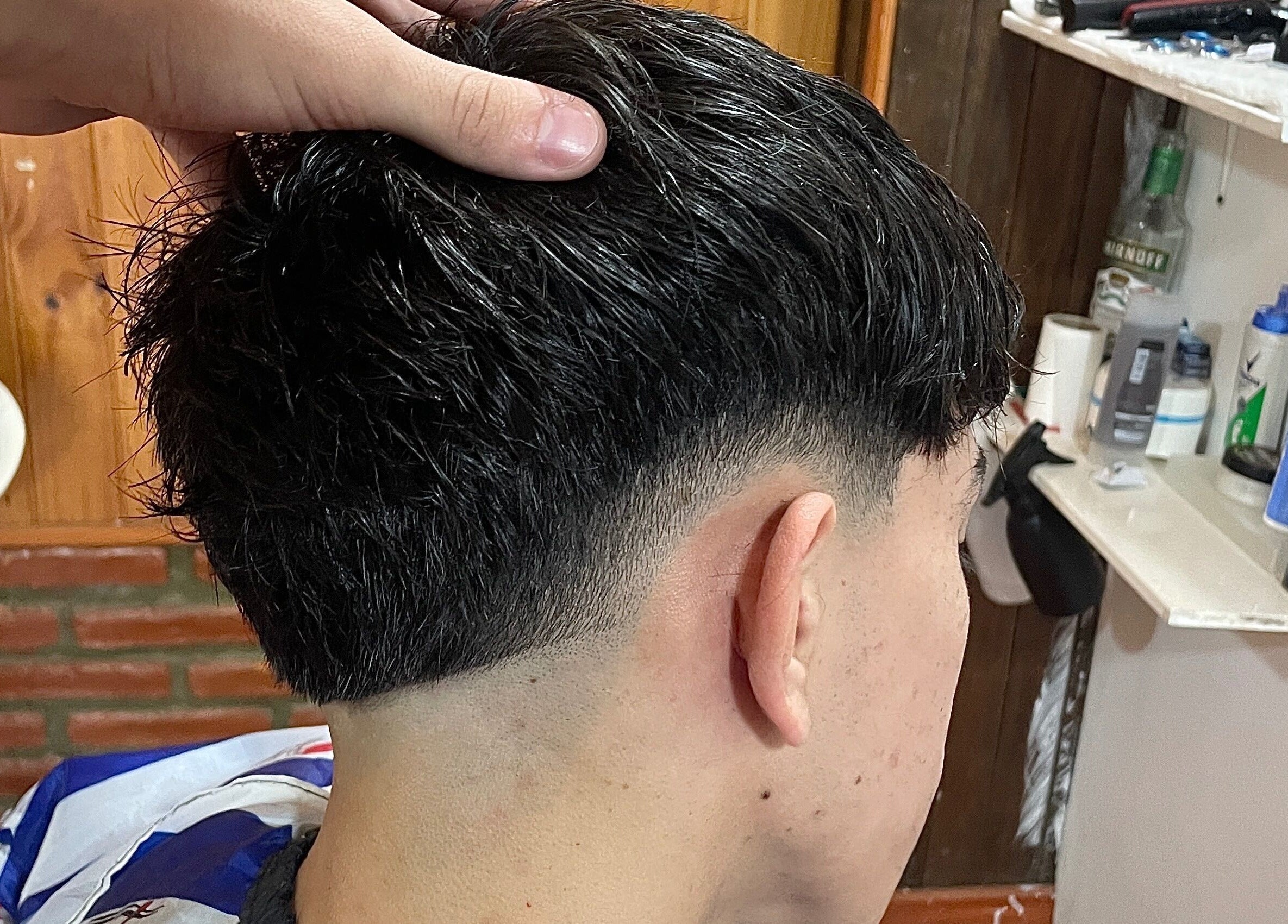 Close-up of a precision fade haircut at IcebarberStudio, San Luis, San Luis, AR.