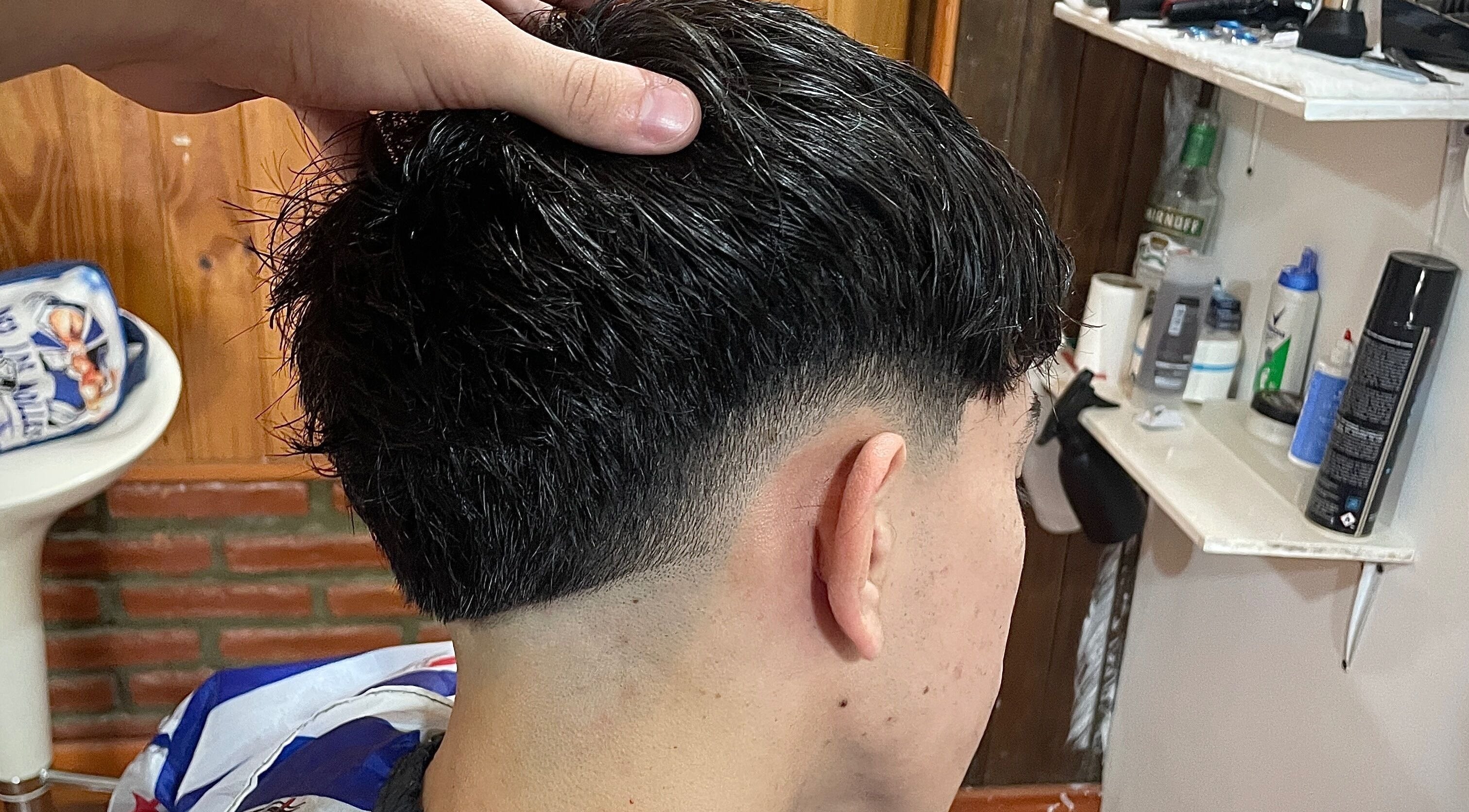Close-up of a precision fade haircut at IcebarberStudio, San Luis, San Luis, AR.