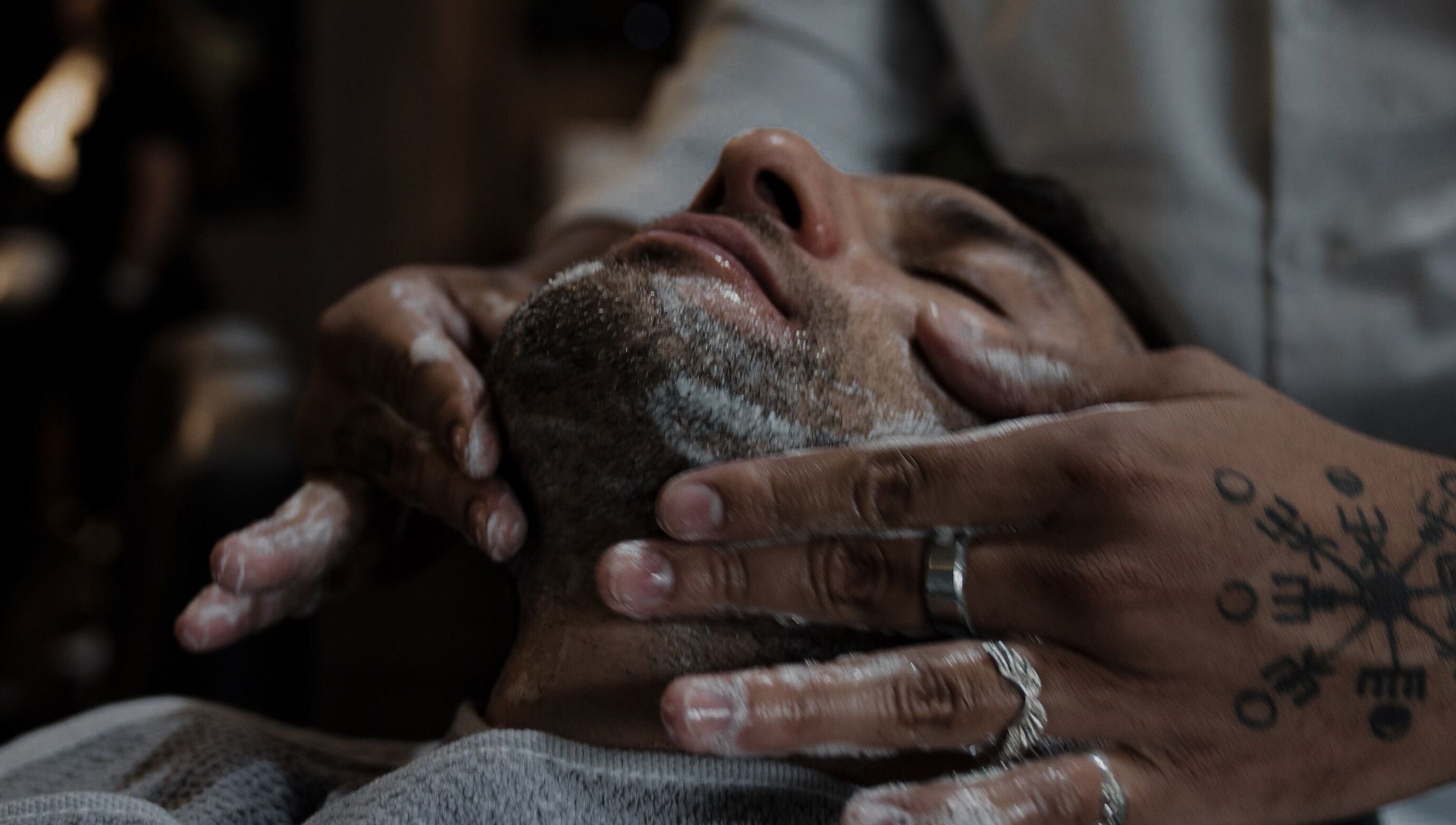 Close-up of a face massage at District Barber Society, Naucalpan De Juárez, Estado De México, MX.
