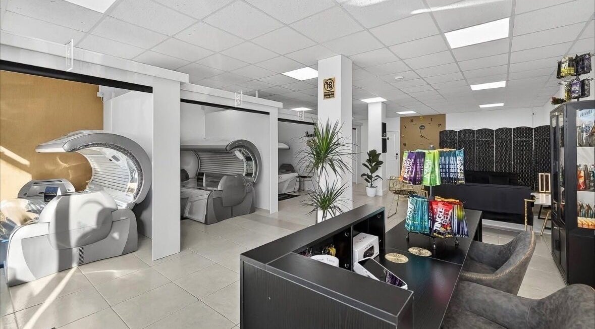 Modern tanning beds and seating area in Cknails, Plymouth, England, GB’s serene beauty venue.