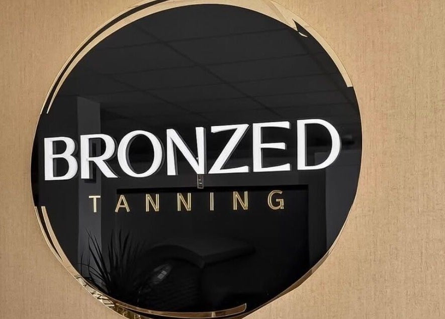 Bronzed Tanning signage at Cknails in Plymouth, England, GB, showcases a sleek, modern look.