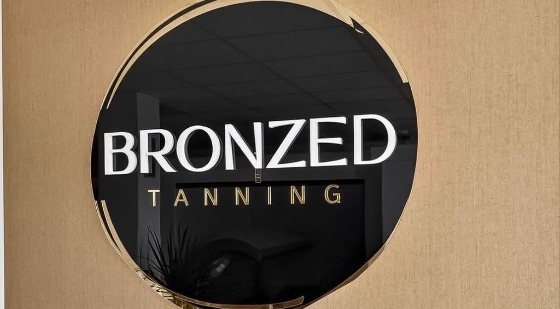 Bronzed Tanning signage at Cknails in Plymouth, England, GB, showcases a sleek, modern look.