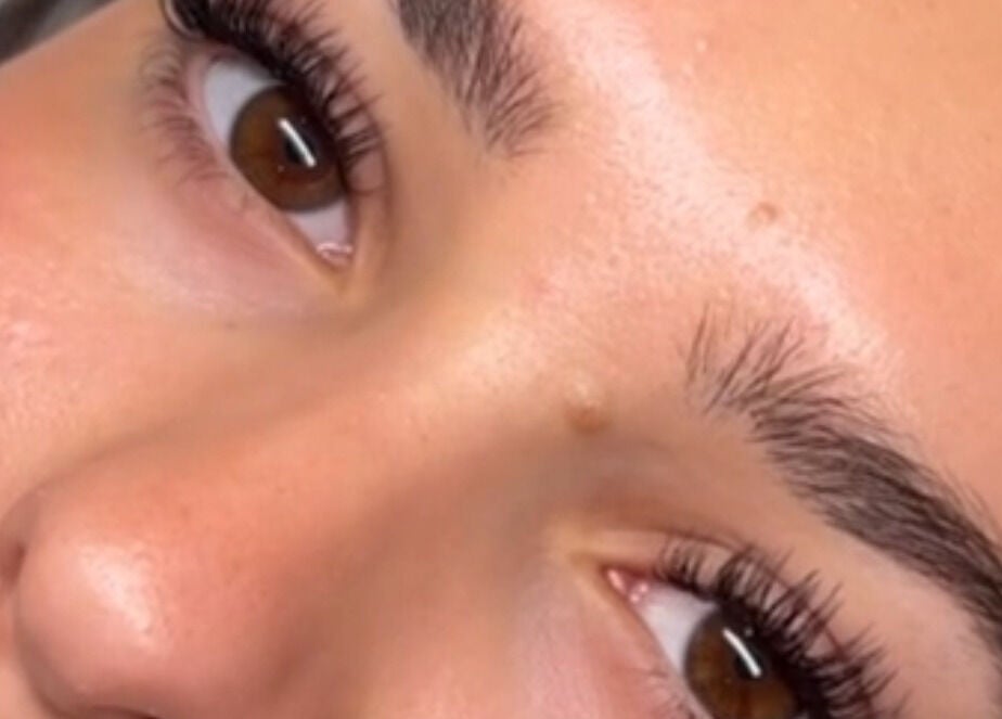 Close-up of styled eyebrows and lashes at With Love, Highcliffe, England, GB, highlighting beauty expertise.