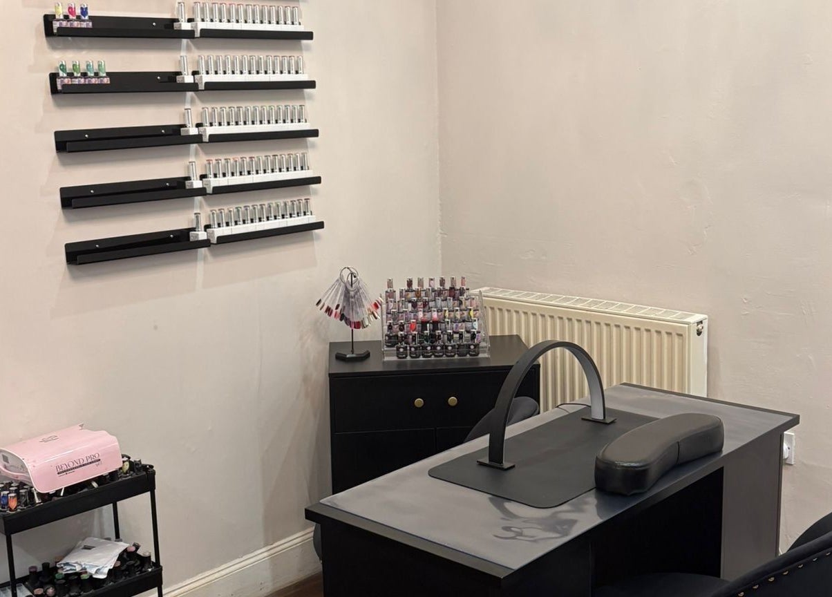 Chantelle Fairbairn Makeup Artistry nail station in Camelon, Scotland, GB with organized polish display.