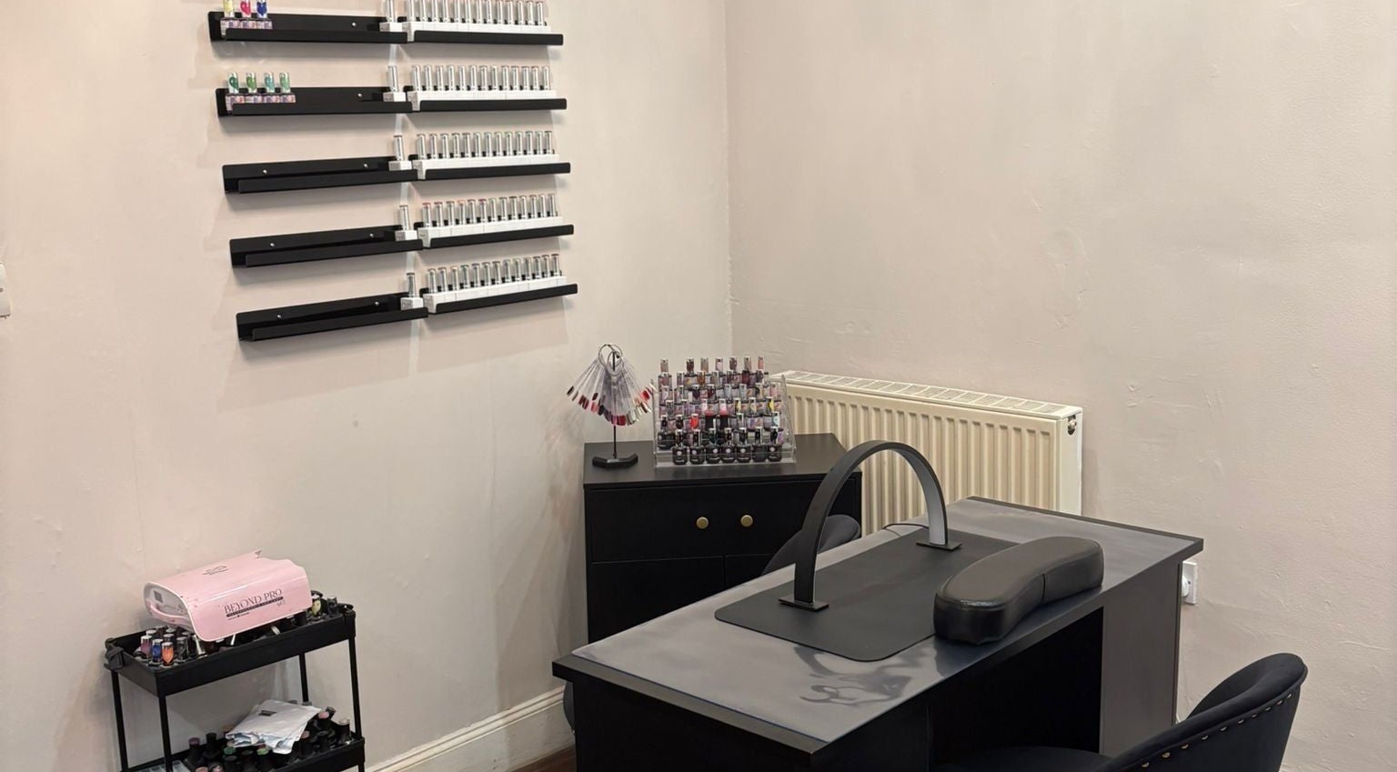 Chantelle Fairbairn Makeup Artistry nail station in Camelon, Scotland, GB with organized polish display.