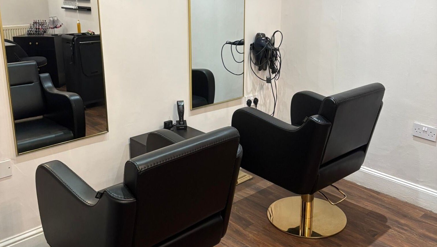 Modern salon chairs and mirrors at Chantelle Fairbairn Makeup Artistry in Camelon, Scotland, GB.
