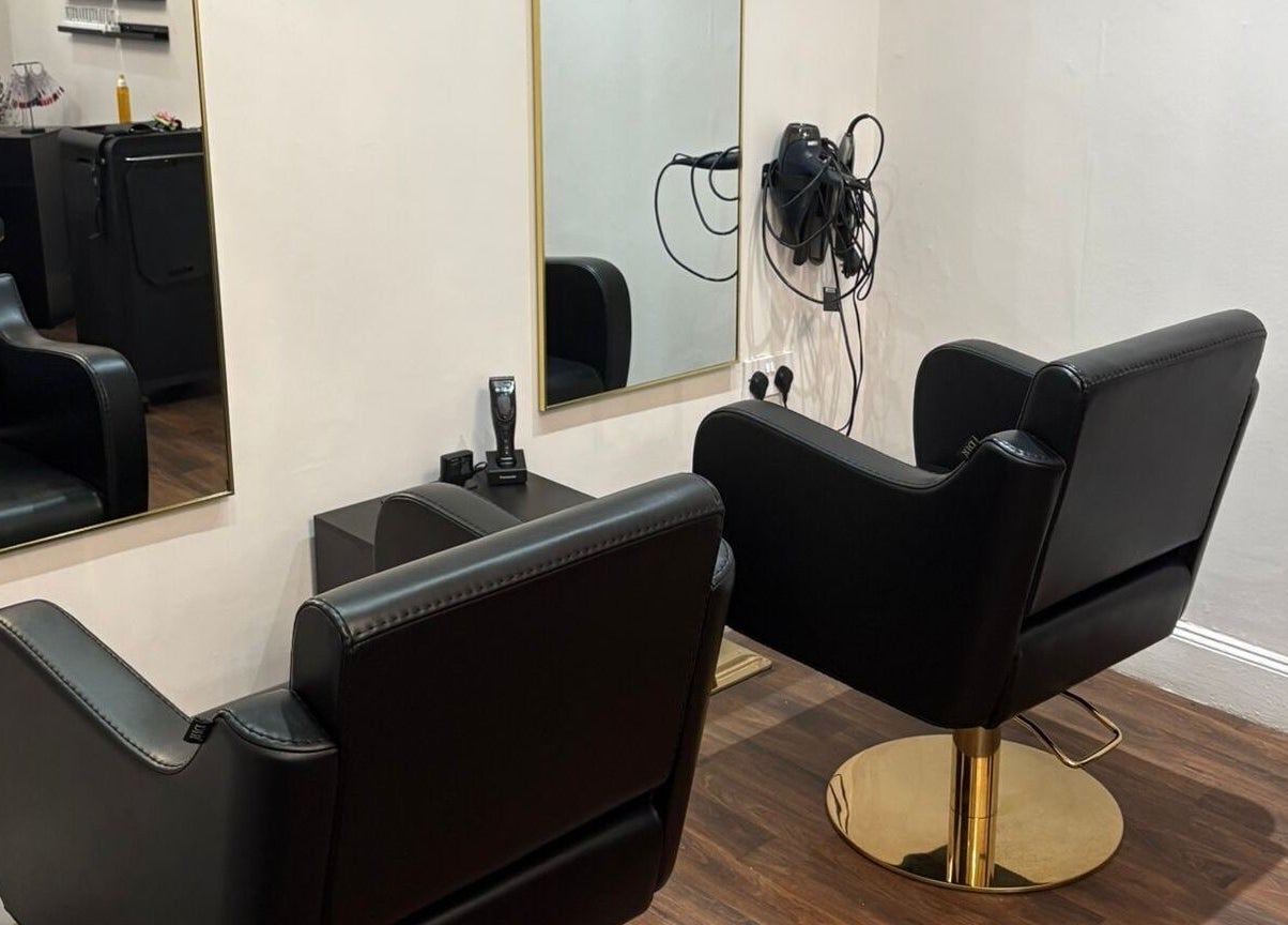 Modern salon chairs and mirrors at Chantelle Fairbairn Makeup Artistry in Camelon, Scotland, GB.
