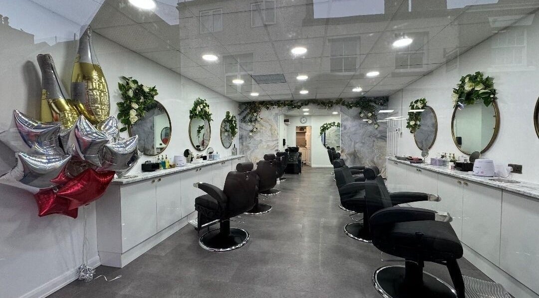 Elegant interior of Olympus Hair, Chester, England, GB with stylish chairs and decorative mirrors.