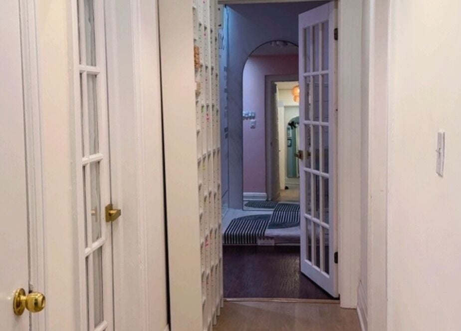 Chic hallway leading to rooms at Beautique Seoul Studio in Toronto, Ontario, CA with stylish decor.