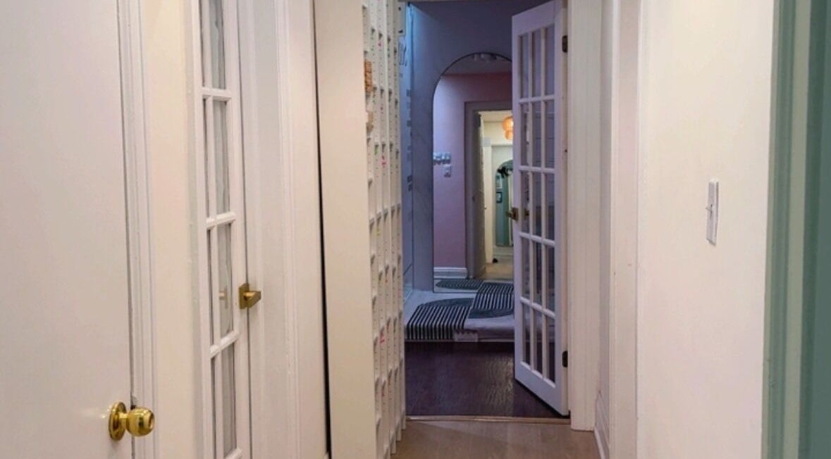 Chic hallway leading to rooms at Beautique Seoul Studio in Toronto, Ontario, CA with stylish decor.