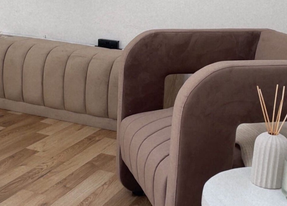 Elegant seating area at Lash & Brow Expert, London, England, GB, featuring modern decor and a calming ambiance.