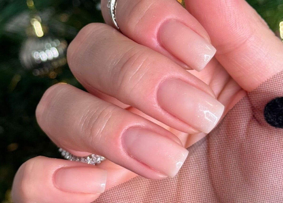 Nude manicured nails at Arlène Nails, GB, showcasing sophisticated elegance.