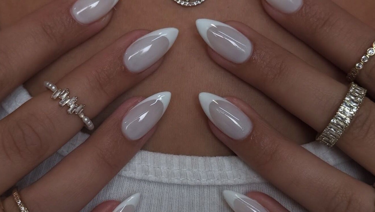 Elegant white-tipped nails at Sole Beaut& Nail, Toronto, Ontario, CA, showcasing exquisite manicure artistry.