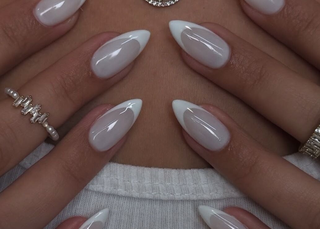 Elegant white-tipped nails at Sole Beaut& Nail, Toronto, Ontario, CA, showcasing exquisite manicure artistry.