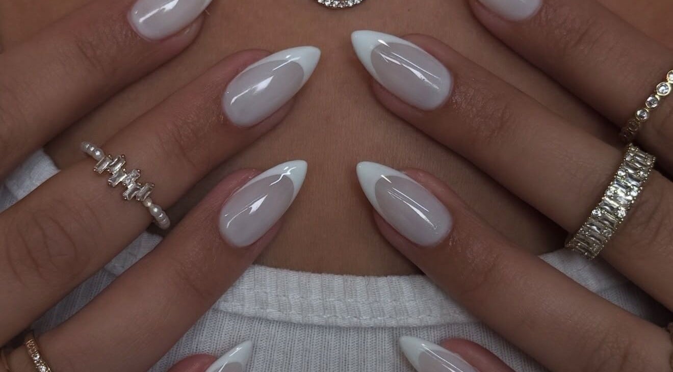 Elegant white-tipped nails at Sole Beaut& Nail, Toronto, Ontario, CA, showcasing exquisite manicure artistry.