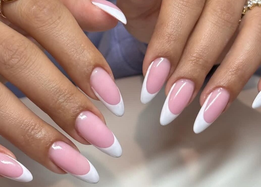 Elegant pink and white French manicured nails at Sole Beaut& Nail in Toronto, Ontario, CA.